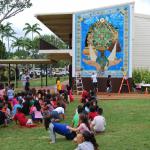 Kipapa students enjoy their new mural. Most joyful for them is that they helped to build it, using over 15,000 pieces of smalti to create the border.