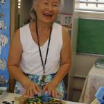 Music Teacher Betty Tizono works on a mosaic.