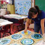 A team of assistants, parents and teachers finished the grouting.